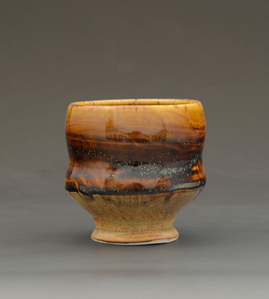 Slip-brushed cup with amber glaze by Rob Flye