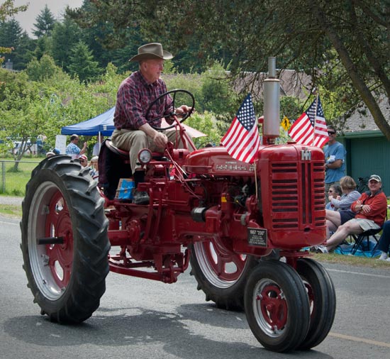 Robert Burt driving tractor during July 4th 2011 parade.