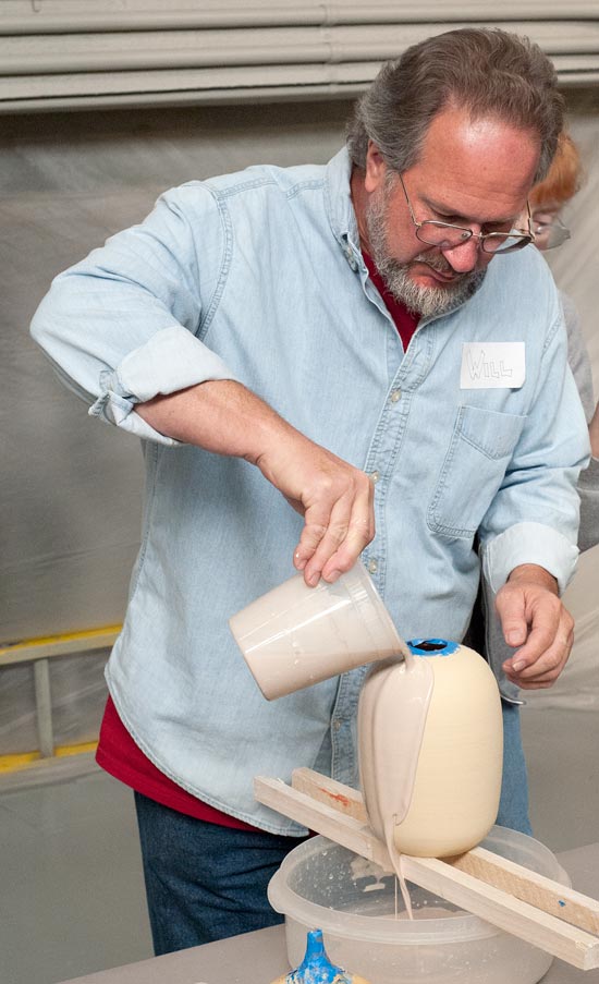 Will Jacobson pours on a coat of sacrificial glaze