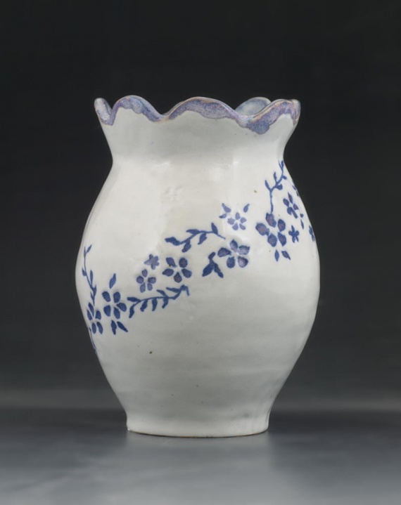White vase with blue floral design by Elizabeth Tsoy