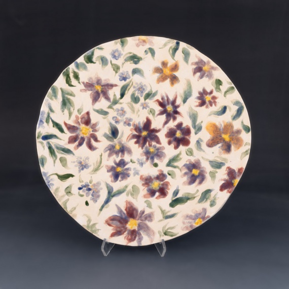 Plate with painted flower design by Helen Shen