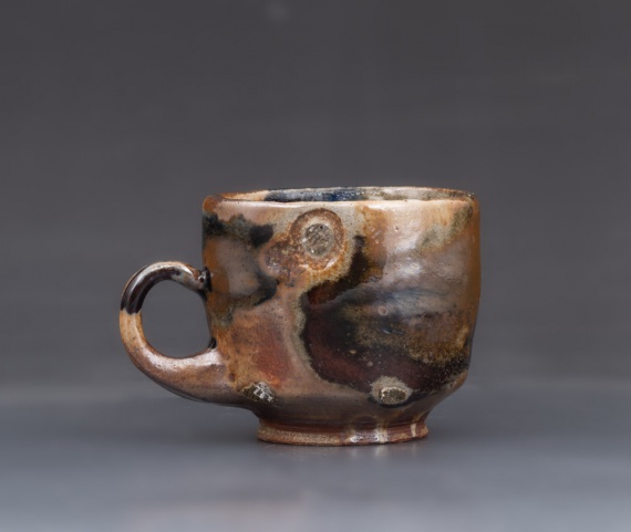 Side-fired shino cup with wood ash by Jaimie Murray
