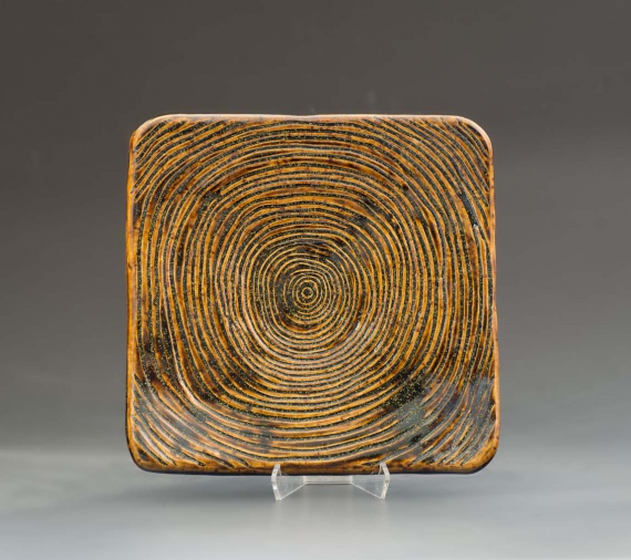 Square amber tray with carved treerings by Kaylee Feeney
