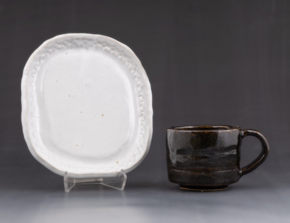 White tray and black cup with handle by Maia Olsen