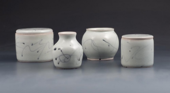 Small porcelain vessels with black underglaze trailing by Oliver Hopcraft