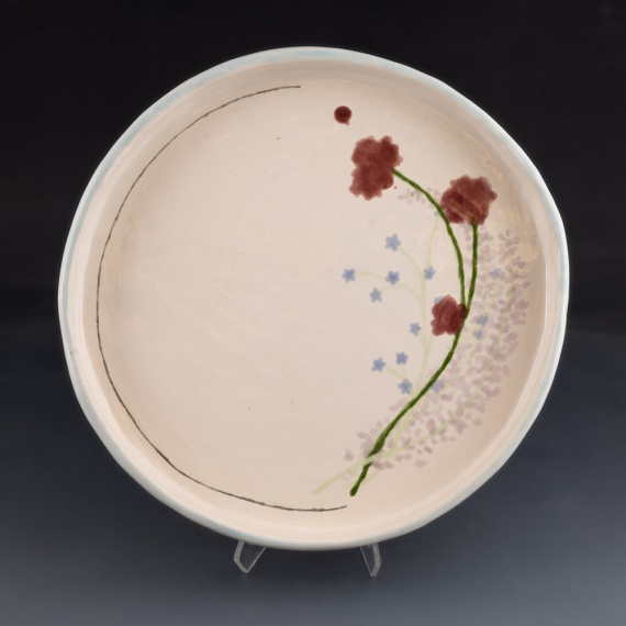 Round white tray with flower fesign by Sam Frank