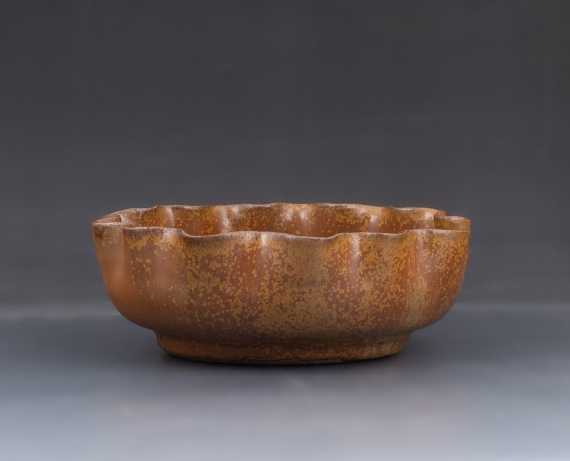 Altered bowl with Shaner's Gold glaze by Simone Herrell