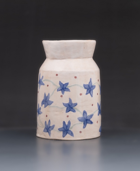 White vase with blue flower pattern by Sonja Gebhardt