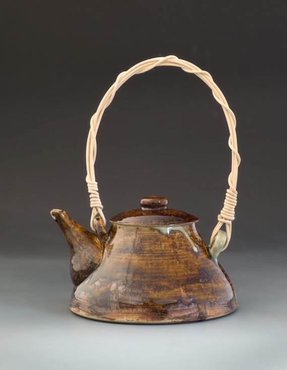 Amber teapot with woven handle by Temby Song