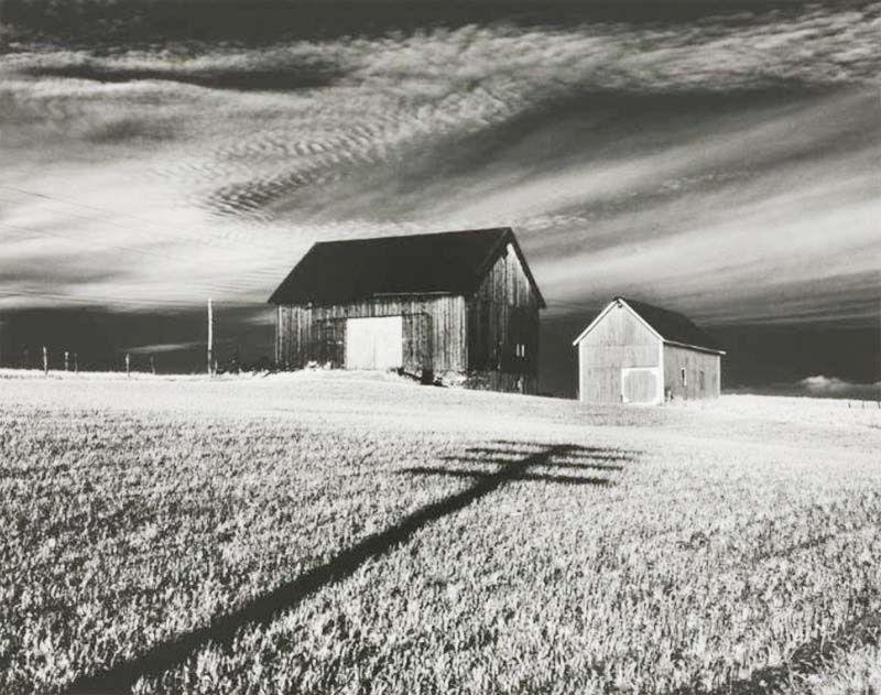 <p><b>Minor White</b>, <i>Two Barns and Shadow</i>, in the vicinity of Naples and Danseville, New York, 1955.</p>