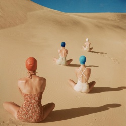 <p><b>Clifford Coffin</b>, <i>American Vogue, June 1949</i>. Models sitting on sand dunes in California wearing swimsuits by Cole of California, Mabs, Caltex and Catalina.</p>
