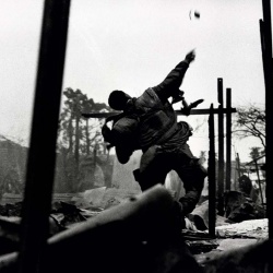 <p><b>Don McCullin</b>, <i>U.S. Marine throwing a hand grenade during the Têt offensive, Battle of Hué, Vietnam, February 1968</i>.</p>