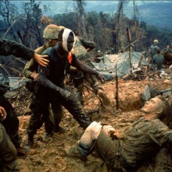 <p><b>Larry Burrows</b>, <i>Reaching Out: wounded US marine Jeremiah Purdie (centre) is led past stricken comrades after a fierce firefight for control of Hill 484 in South Vietnam</i>, 1966.</p>