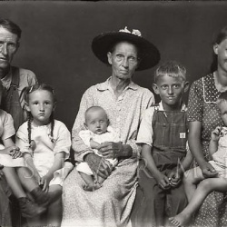<p><b>Mike Disfarmer</b>, <i>Man and Woman with Six Children</i>.</p>