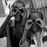 <p><b>Abbas Attar</b>, <i>MALI. Bakodjikorone. 1994. Children imitating the photographer</i>.</p>