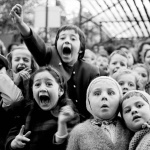 <p><b>Alfred Eisenstaedt</b>, <i>Children at Puppet Theatre III</i>, 1963. Children watch the story of "Saint George and the Dragon" at an outdoor puppet theater in Paris.</p>