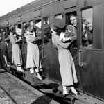 <p><b>Alfred Eisenstaedt</b>, <i>London, 1935. Soldiers departing for Egypt from Feltham Station lean out of their windows to kiss their loved ones goodbye.</i></p>