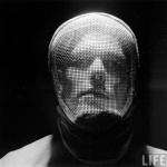 <p><b>Andreas Feininger</b>, <i>Fencer with Saber Mask</i>, 1955.</p>