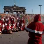 <p><b>Bruno Barbey</b>, <i>GERMANY. West Berlin. Santa Clauses pose for a group photo by the Berlin Wall. 1989</i>.</p>
