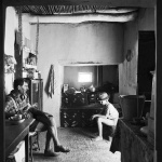 <p><b>David Goldblatt</b>, <i>Seated in Martjie Marais's kitchen: her husband's brother, Johannes, and her nephew Derick. Gamkaskloof, Cape Province (Western Cape)</i>, 1967.</p>