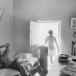 <p><b>David Goldblatt</b>, <i>Lewies Nel in his voorkamer. On the battery-powered turntable Jeremy Taylor was singing 'Ag pleeze Deddy won't you take us to the drive-in'. Gamkaskloof, Cape Province (Western Cape)</i>, 1966.</p>