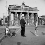 <p><b>David Seymour</b>, <i>Germany. Berlin. A man walking his children near the Brandenburg Gate.</i> 1947.</p>