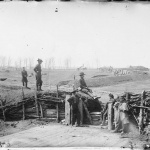 <p><b>George N. Barnard</b>, <i>[Manassas, Va. Confederate fortifications, with Federal soldiers]</i>, 1861-1862.</p>