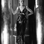 <p><b>George Hoyningen-Huene</b>, <i>Model (Bettina Jones) wearing a Schiaparelli Pinafore evening dress of cire satin with a bow on the side and a low</i>, 1930.</p>