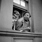 <p><b>Gordon Parks</b>, <i>Woman and Dog in Window</i>, Harlem, New York, 1943.</p>