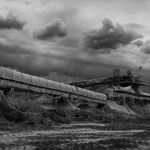 <p><b>Josef Koudelka</b>, <i>FRANCE. Meuse. Sorcy. 1998. Network of conveyor belts enabling the deposit of limestone fines which can not be used in the kilns.</i></p>