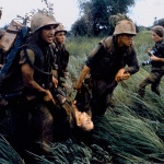 <p><b>Larry Burrows</b>, <i>Four Marines recover the body of a fifth as their company comes under fire near Hill 484</i>, 1966. NOTE: At right is the French-born photojournalist Catherine Leroy (1945 – 2006); she was cropped out of the version of this photo that originally ran in LIFE.</p>
