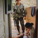 <p><b>Larry Burrows</b>, <i>An American soldier contemplates a woman breastfeeds her baby</i>.</p>