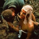 <p><b>Larry Burrows</b>, <i>A dazed, wounded American Marine gets bandaged during Operation Prairie near the DMZ during the Vietnam War</i>, 1966.</p>