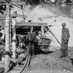 <p><b>Lewis Hine</b>, <i>Hard work and dangerous for such a young boy. James O'Dell, a greaser and coupler on the tipple of the Cross Mountain Mine, Knoxville Iron Co., in the vicinity of Coal Creek, Tenn. James has been there four months. Helps push these heavily loaded cars. Appears to be about 12 or 13 years old. Location: Coal Creek, Tennessee.</i> December 1910.</p>