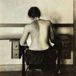 <p><b>Lewis Hine</b>, <i>Mildred Benjamin, 17 years old. Right dorsal curvature. Scoliosis. Right shoulder higher than left. Shows incorrect position required to perform this kind of work. Stopping use of right arm. Location: Boston, Massachusetts</i>. January 1917.</p>