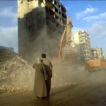 <p><b>Lynsey Addario</b>, 2006. SOUTH BEIRUT, LEBANON.  Mustafa Olwan and his wife Fatima Asadi, await the remains of their apartment in the destruction in Beirut's southern suburbs as workers clean up debris and clear roads throughout the neighborhood, August 30, 2006.  Lebanese families are still returning daily to the detroyed neighborhood to watch buildings be unearthed floor by floor, as they wait for their floor to appear to reclaim what belongings still remain.</p>