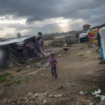 <p><b>Lynsey Addario</b>, Syrian refugees live amidst mud and raw sewage in tents originally set up for seasonal workers near the Lebanese village of Majd al-Anjar, along the Syrian border in the Bekaa Valley, in Lebanon, January 20, 2013. Lebanon has roughly 200,000 Syrian refugees already registered with the United Nations High Commission of Refugees, and a presumed thousands of others awaiting registration.  The UNHCR estimates that the total number of Syrian refugees is over 600,000 in countries bor</p>