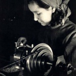 <p><b>Margaret Bourke-White</b>, <i>At the Lathe, “Hammer Sickle” Factory, Moscow</i>, circa 1931.</p>