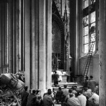 <p><b>Margaret Bourke-White</b>, <i>American soldiers attend Mass in March 1945 in the bombed cathedral of Cologne</i>.</p>