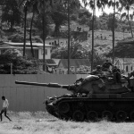 <p><b>Philip Jones Griffiths</b>, <i>GRENADA. Grenadians for generations had welcomed the only foreigners they encountered - tourists - so U.S. forces had the rare experience of being surrounded by polite and friendly locals. For many Americans, the Grenada invasion was seen as a morale booster after the defeat in Vietnam. 1983</i></p>