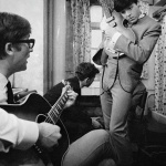 <p><b>Philip Jones Griffiths</b>, <i>ENGLAND. 1961.The Beatles' early days. John Lennon and Paul McCartney with guitars.</i></p>