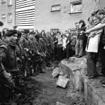 <p><b>Philip Jones Griffiths</b>, <i>IRELAND. Belfast. 1972. Kids spraying soldiers.</i></p>