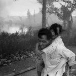<p><b>Philip Jones Griffiths</b>, <i>The battles for Saigon. At Tet and again in Mai, the vietcong struck Saigon. They aimed for the middle-class districts which were duly destroyed by United States firepower. Looting was extensive, so people fled with everything they could carry.</i></p>