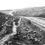 <p><b>Roger Fenton</b>, <i>The Valley of the Shadow of Death</i>, 1855. Version with cannonballs to side of road.</p>