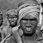 <p><b>Sebastião Salgado</b>, <i>COAL, INDIA: Workers (women and men) under contract to truck owners load trucks with coal. A dirty and exhausting job, it is badly remunerated with a maximum daily salary of only twenty-two rupees (U.S. $1.30).  Dhanbad, Bihar State, India, 1989.</i></p>
