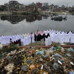 <p><b>Stanley Greene</b>, from 'daily life in kamrangirchar slum, dhaka', 2011. White, pink, black sheets and garbage on the Kamrangichar peninsula in Kamrangirchar.</p>