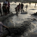 <p><b>Stanley Greene</b>, from 'daily life in kamrangirchar slum, dhaka', 2011. Children playing and swimming in toxic waste which has been dumped from the chemicals factories in the Kamrangichar peninsula in Kamrangirchar.</p>