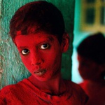<p><b>Steve McCurry</b>, <i>INDIA. Mumbai (Bombay). 1996. Red Boy during Holi festival.</i></p>