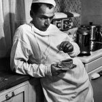 <p><b>W. Eugene Smith</b>, <i>Dr. Ceriani resting in his kitchen, after having spent the night operating. Kremmling, Colorado, USA. 1948.</i></p>