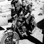 <p><b>William Claxton</b>, <i>Steve McQueen Glides in From Desert Race, Mojave Desert, CA</i>, 1963</p>